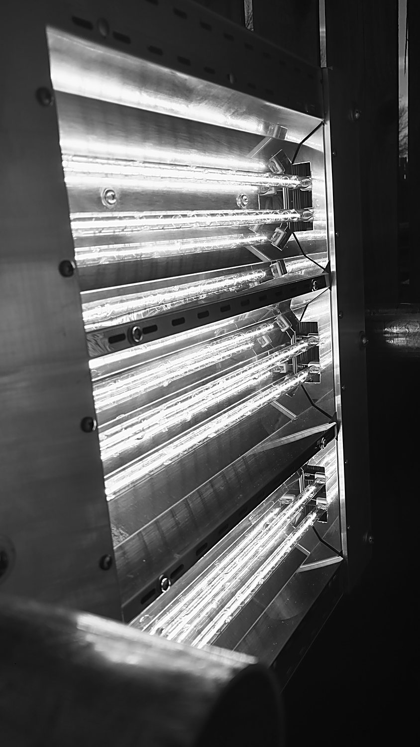 The original 2016 infrared emitter array, glowing — the first proof that directed radiant energy could lift a coating