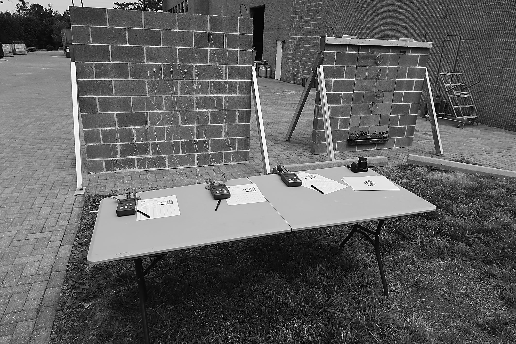 Instrumented CMU under test — sensors recording the wall's response